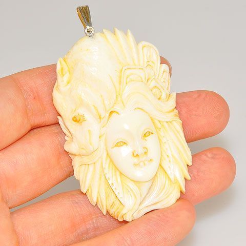 Sterling Silver Carved Bone Goddess and Rhino Pendant