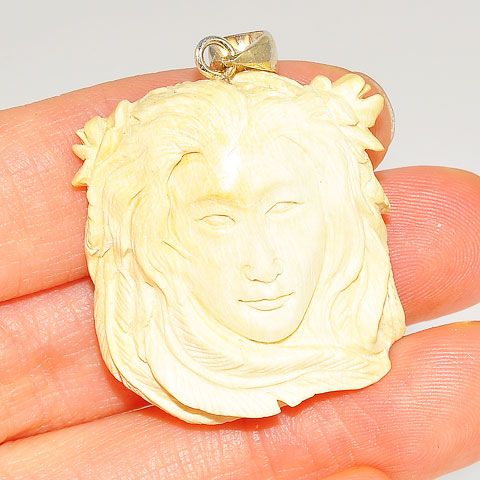 Sterling Silver Carved Mammoth Ivory Face Pendant