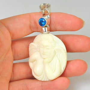 Sterling Silver Carved Bone Angel and Blue Topaz Pendant