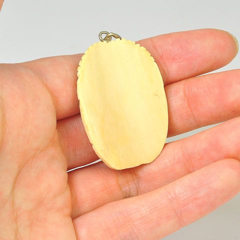 Sterling Silver Fossilized Mammoth Ivory Face Pendant